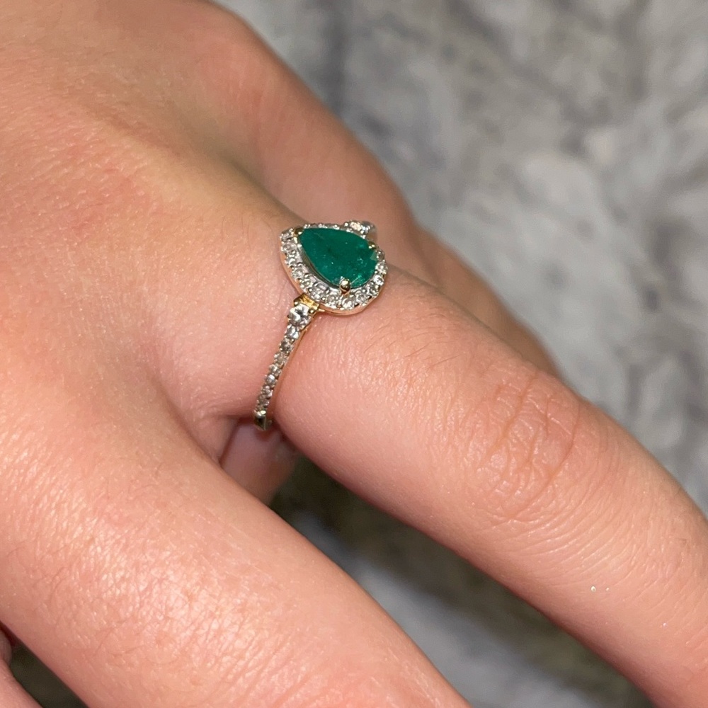 Mined emerald with gold band and diamonds